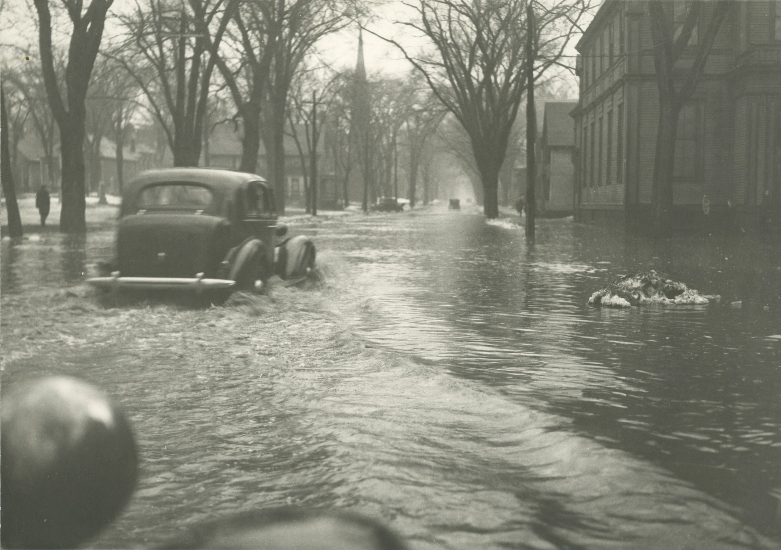 Fredericton experienced a harrowing day of severe flooding that seemed to come out of nowhere with shocking speed in 1936, only to recede just as quickly, taking the city’s railway bridge with it. This picture is taken on the corner of Brunswick and Carleton Streets looking West — a location that was not normally even remotely close to the river! (Provincial Archives of New Brunswick P2-019)