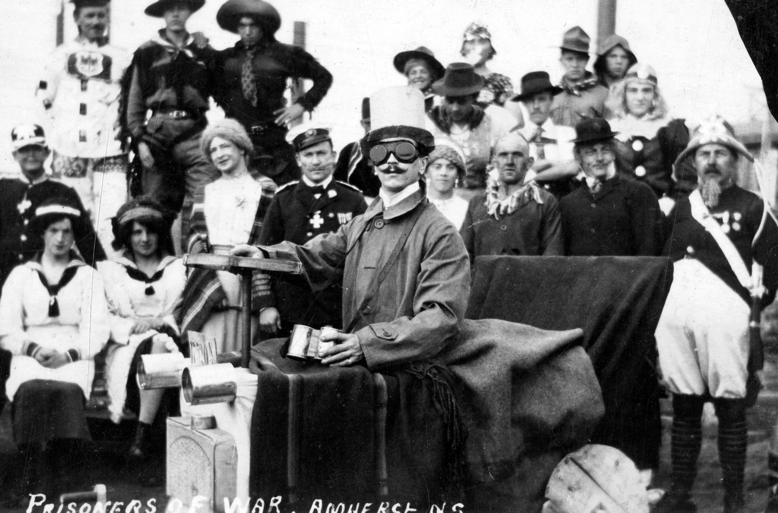 Woodstock NB photographer John Muir McKinly's photographs of German Prisoners of War held in the the Amherst Internment Camp, showing smiling prisoners dressed up in costumes for musicals and plays, contrasts sharply with the description of life in the camp by its most famous prisoner: Leon Trotsky, who missed the early part of the Russian Revolution because he was in Nova Scotia. (Provincial Archives of New Brunswick P827-MS1-131)
