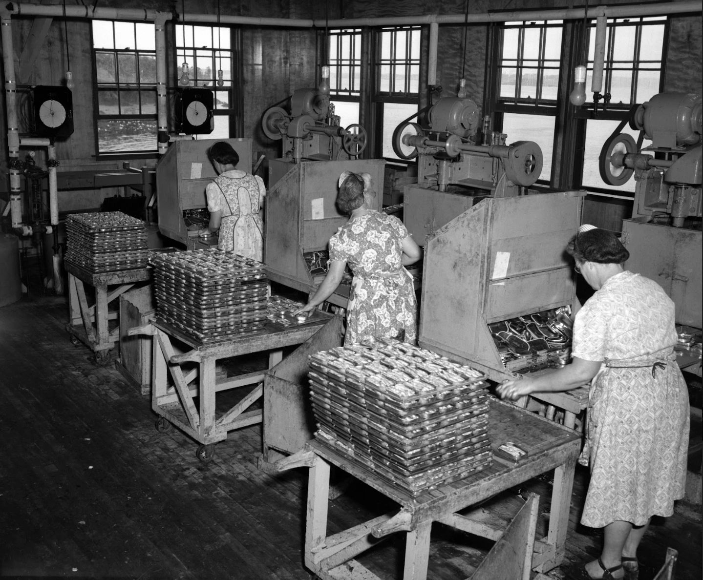 Women standing in Connors Brothers factory packing sardines. The photographs in this week’s article were all taken by the New Brunswick Travel Bureau, which travelled around taking photos which, lets just say, may have been a little bit more glammed up than ordinary life! What I’m trying to say here is that the ladies packing the sardines in Blacks Harbour may or may not have actually dressed up in ther Sunday best for work everyday like we see in this picture! (Provincial Archives of New Brunswick P93\CH\291)