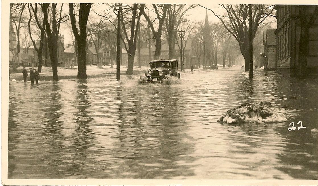 Car driving (swimming?) though the streets of Fredericton. I believe this may have been Brunswick Street. (Barry Murray's private photo collection)