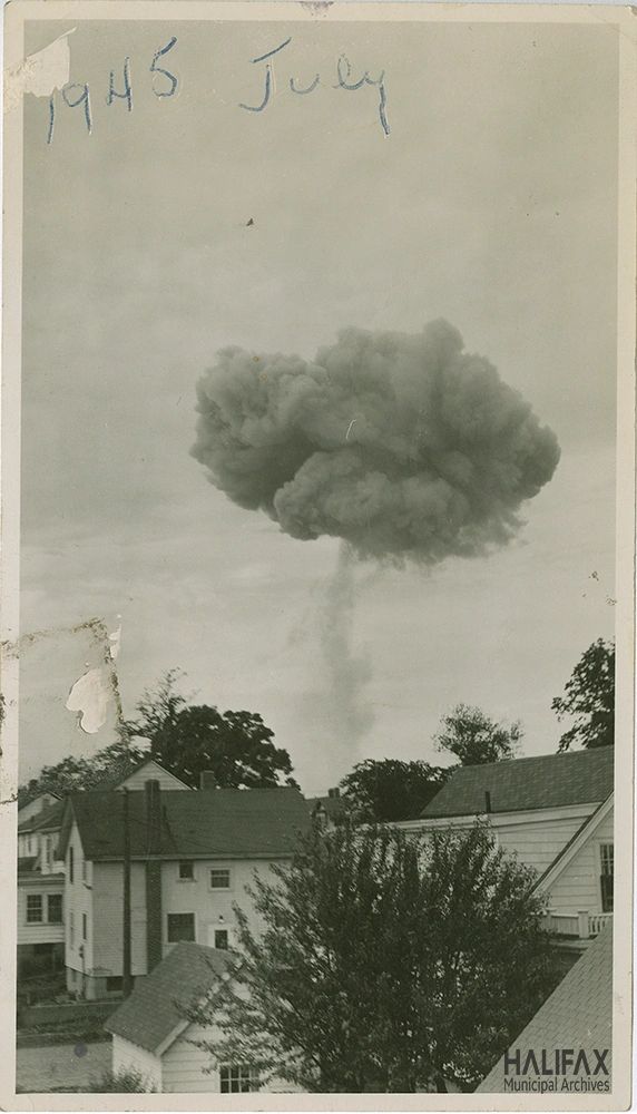 A mushroom cloud from the 1945 Halifax Explosion rising above the city. (Halifax Municipal Archives cr6-104s)